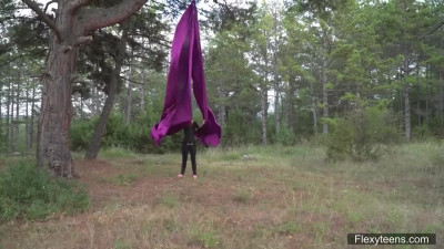 Flexible Kim Nadara shows off her body while on the rope in the outdoors