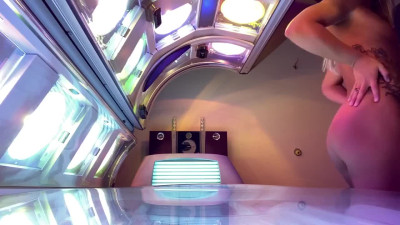 Big ass babe can't resist squirting all over tanning bed for her husband