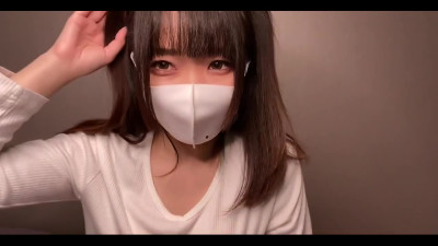 Cute Japanese in mask plays with her boobs in solo