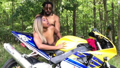 A black beauty enjoys her boyfriend's black cock outdoors.