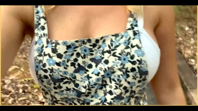 Blonde amateur MILF exposes her big tits outdoors in a public park