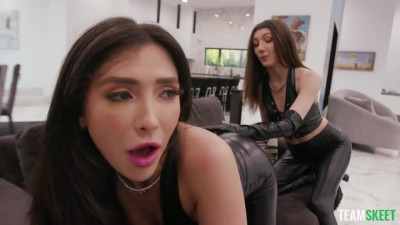 Two latex sluts dominate a tied up and blindfolded man
