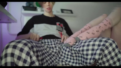 Schoolgirl in sexy pink socks gives footjob to her stepbrother