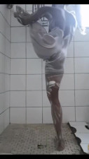 Flexible black girl shows soapy ass and masturbates in shower