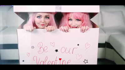 Two sweet girls from a gift box are ready for St Valentine's Day