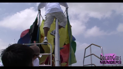 Wild exhibitionists flashing their tits and bare pussies while parasailing on a public beach
