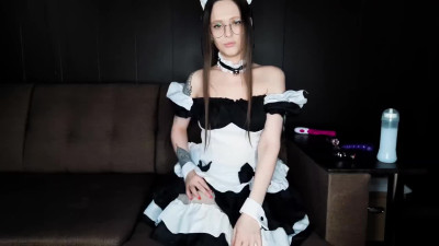 Maid in round glasses catches a long cumshot on her belly