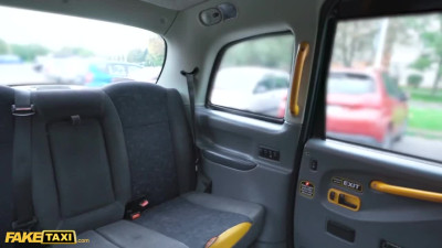 Horny Spanish girl touches herself in the back seat of fake taxi