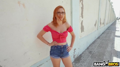 Redhead shakes her juicy tits while being fucked in the middle of the street