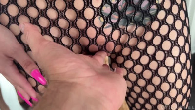 Fishnet clad Nicole Aria tries out footjobing for a harder cock