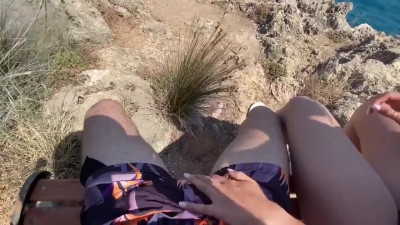 An amateur couple have a public, romantic and unashamed sex at the sea's coast.