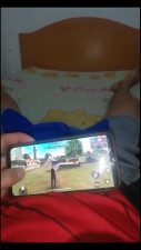 Dude playing videogames on his phone while his horny gf blows his cock