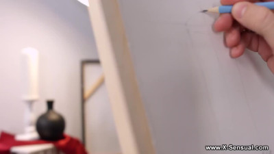 Two artsy chicks are having a passionate threesome with a guy