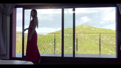 Erotic outdoor solo session with model in red dress