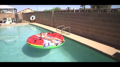 Tanned chick with huge fake tits gets facial after fuck in the pool