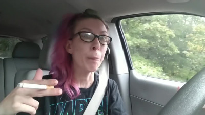 Bored smoker jerks off with toys while she drives a car on the road