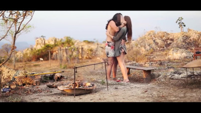 Risky babe fucks with guy by the campfire