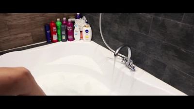 Skiny teen chick pets herself in the bathroom