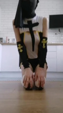 Lusty nun plays with sex toys