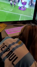 Avid football fan is rooting for her favorite team and enjoying a dick.
