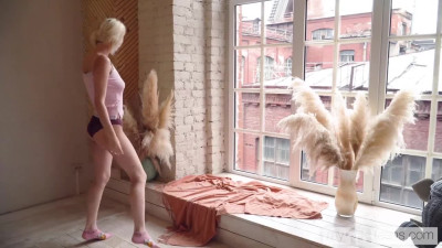 Sweet blonde teen masturbates by the window