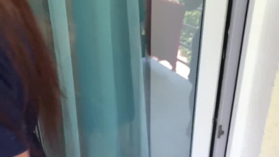 Brunette cutie - escort model satisfies client with quick BJ on the Balcony