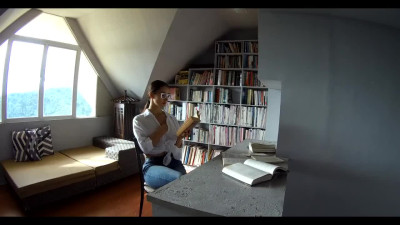 A young and charming student is so excited by reading