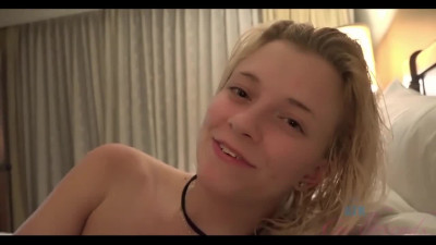 Petite blonde cutie with small tits lies on the bed and helps to relax