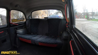 Asian girl with beautiful long legs spreads them on a backseat of Taxi