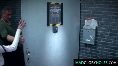 Two sexy chicks take part in a hot gangbang with a glory hole.